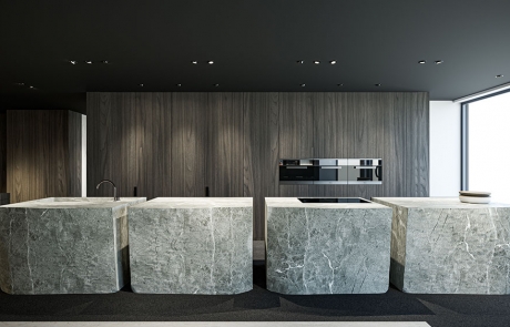 Discover Sophistication in Design: Exclusive Showroom by paul Devriendt architecten Welcome to the pinnacle of modern kitchen design at [Your Firm’s Name], where luxury meets functionality in our state-of-the-art showroom. Our latest collection showcases minimalist elegance with bold marble islands that command attention, set against the backdrop of sleek, dark wood cabinetry. Elegant Marble Islands for Timeless Luxury Each marble island is a masterpiece of design, featuring unique veining patterns and a robust form that speaks to our commitment to quality and durability. The marble's natural beauty adds an air of sophistication and provides a durable surface for both casual dining and high-end entertaining. Sleek Wood Cabinetry with Integrated Appliances Our custom wood cabinetry is designed to blend seamlessly with the latest in kitchen technology. Integrated appliances ensure a sleek, uncluttered look, while providing the high-performance functionality that culinary enthusiasts demand. Contemporary Design for the Modern Home The showroom's design encapsulates the essence of contemporary aesthetics, with clean lines and a monochromatic color palette. The strategic placement of lighting accentuates the textures and materials, creating an inviting ambiance that highlights our attention to detail. Keywords for Your Design Journey: • Luxury showroom • High-end marble countertops • Custom wood kitchen cabinets • Modern kitchen design ideas • Integrated kitchen appliances • Contemporary home interiors • Minimalist kitchen styling • Sophisticated showroom displays • Interior design inspiration • Premium kitchen remodeling